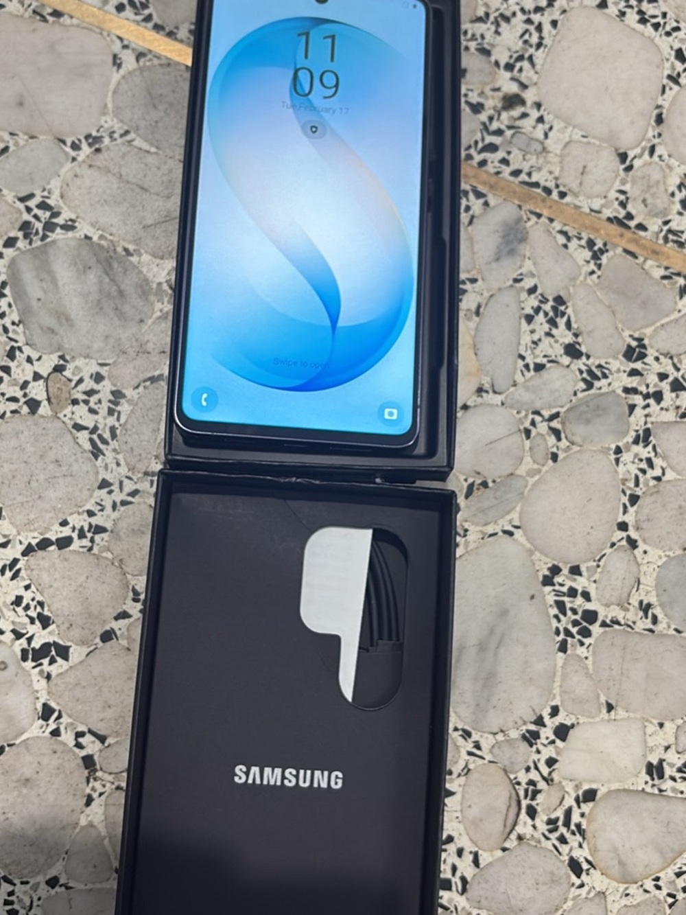 Samsung Black Smartphone with Blue Display